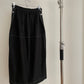 Back view of womens vintage Issey Miyake black skirt with white contrast stitch