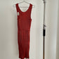 Front view of vintage IM Product red pleated apron dress