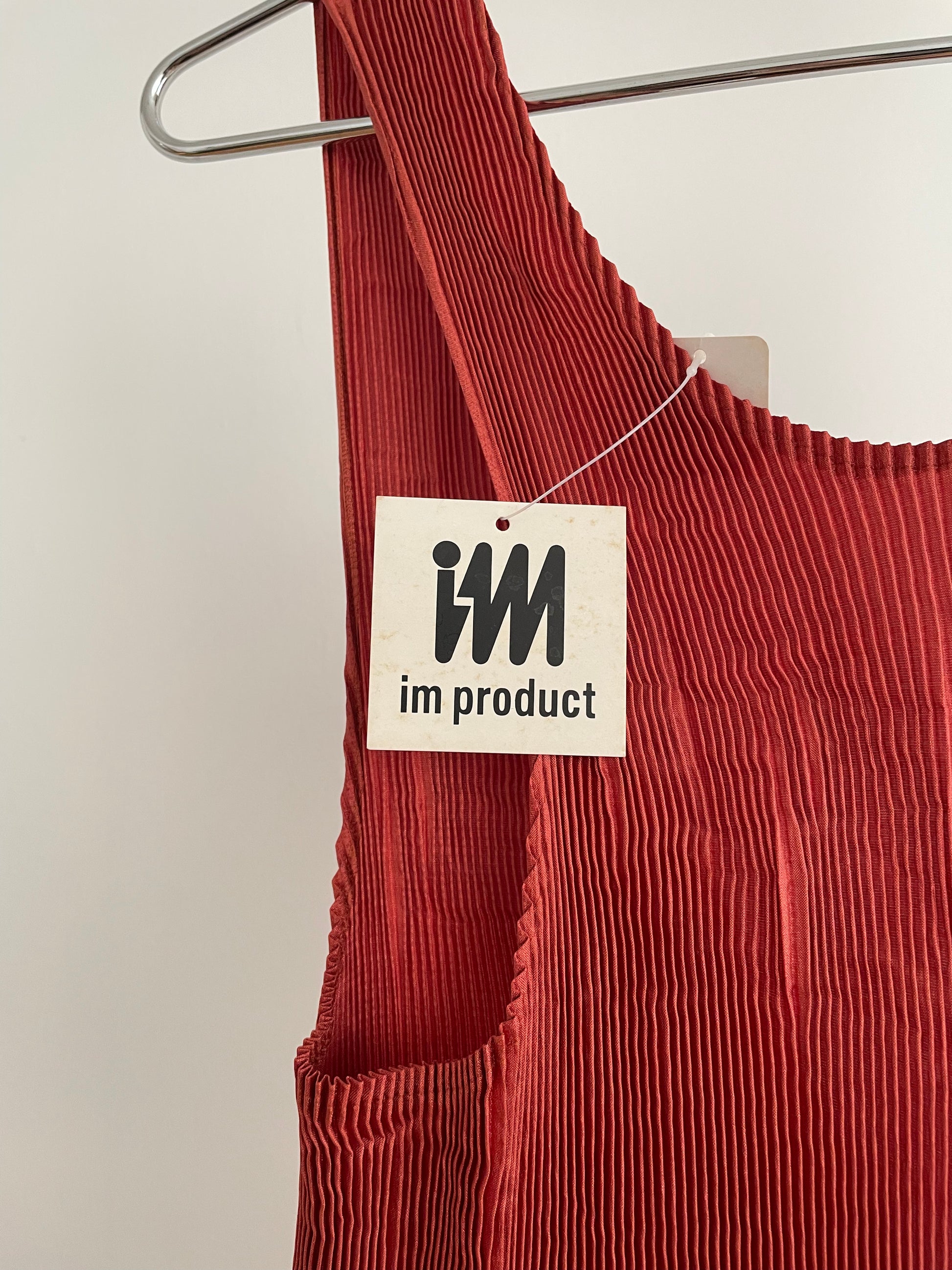 Detail view of vintage IM Product red pleated apron dress