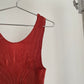 Detail view of vintage IM Product red pleated apron dress