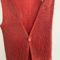 Detail view of vintage IM Product red pleated apron dress