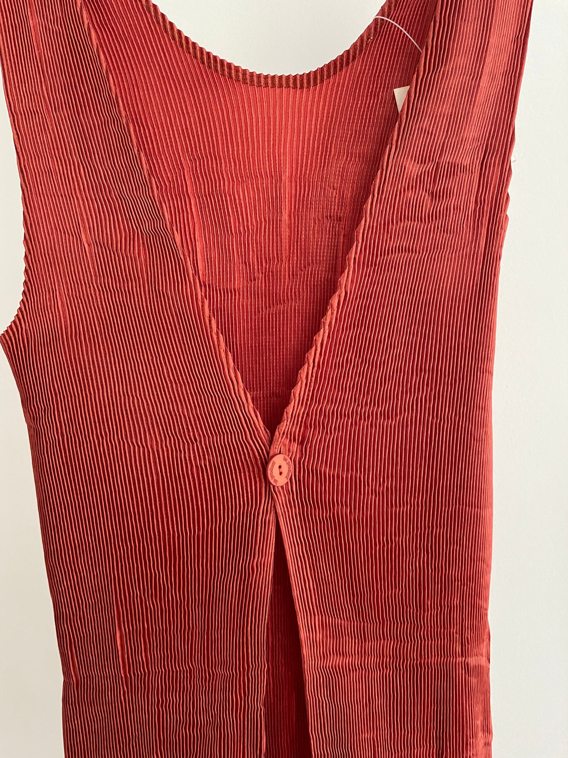 Detail view of vintage IM Product red pleated apron dress