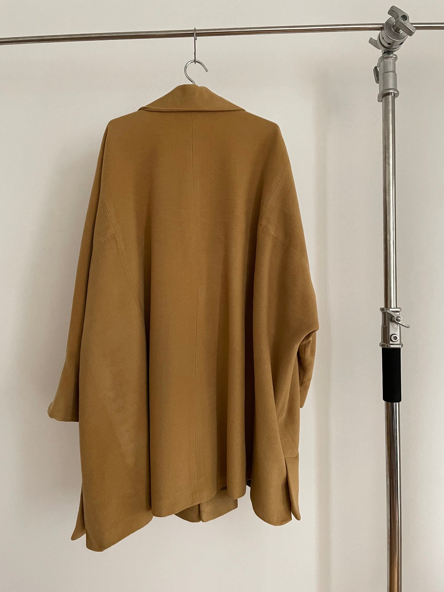 Back view of vintage womens Jil Sander 1980s camel dolman sleeve coat