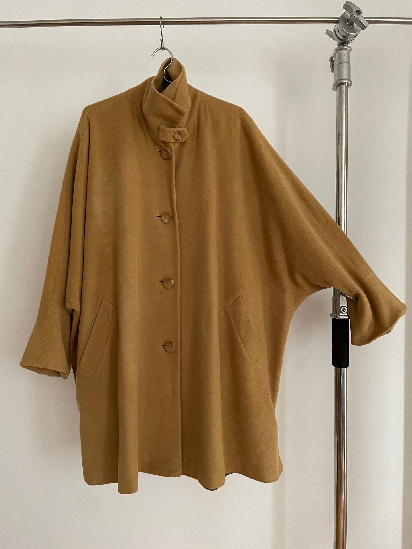 Front view of vintage womens Jil Sander 1980s camel dolman sleeve coat