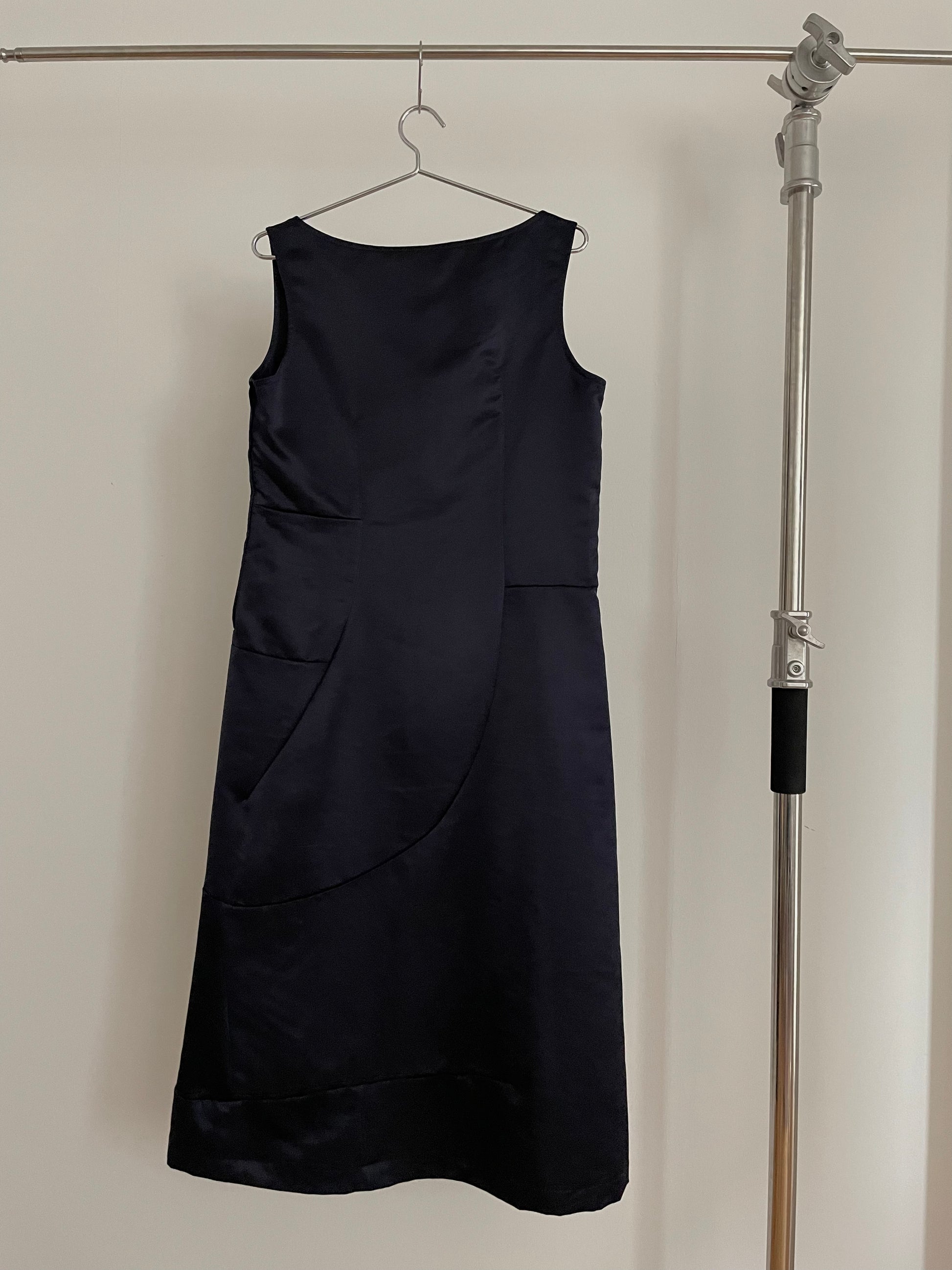 Back view of vintage womens Comme des Garçons black midi dress with geometric panels